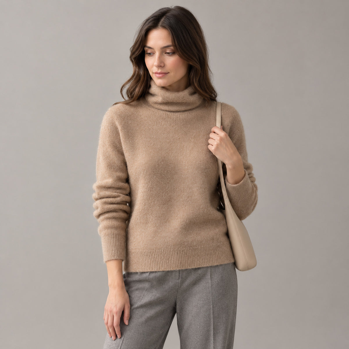 Rothbury Ribbed Knit Turtleneck — Camel turtleneck sweater worn by a model against a neutral studio backdrop.