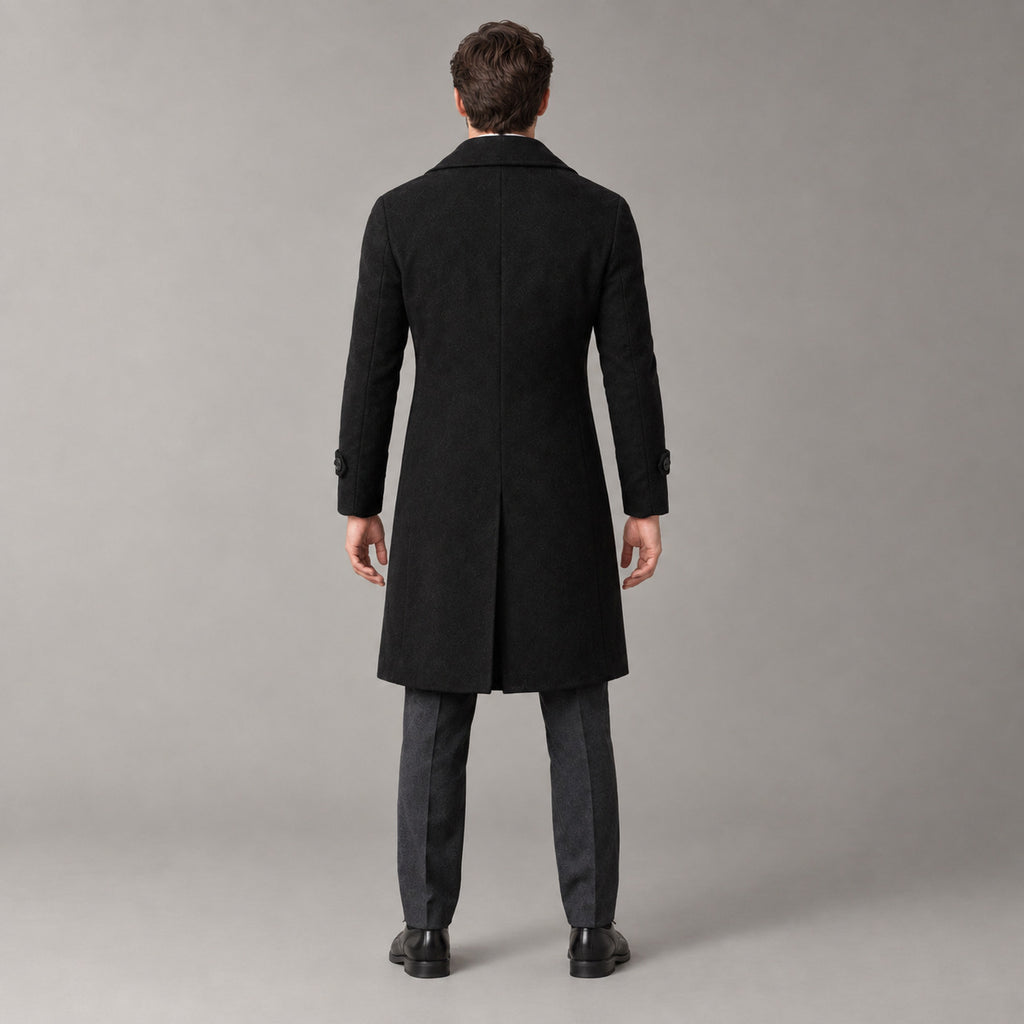 Norbury Cotton Blend Trench Coat — Back of the black double-breasted trench coat worn, showing the centre back vent.