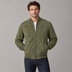 Kinloch Faux Suede Bomber Jacket — Olive faux-suede bomber jacket worn by a model against a neutral studio backdrop.