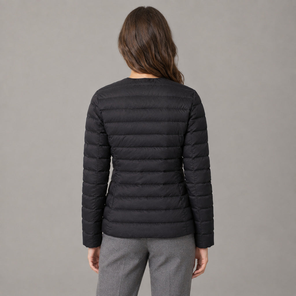 Hatherley Quilted Down Jacket — Back of the black collarless quilted down jacket worn, showing the horizontal quilted baffles.