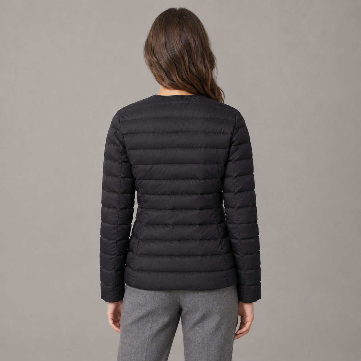 Hatherley Quilted Down Jacket — Back of the black collarless quilted down jacket worn, showing the horizontal quilted baffles.