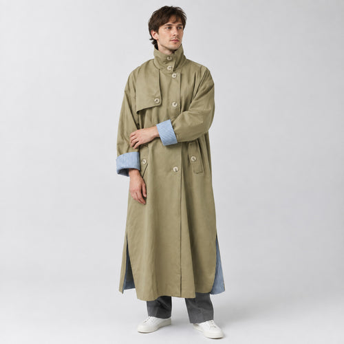 Aynho Oversized Trench Coat — Khaki oversized long trench coat worn by a model against a neutral studio backdrop.