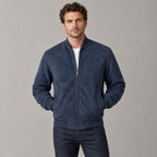 Kinloch Faux Suede Bomber Jacket — Navy faux-suede bomber jacket worn by a model against a neutral studio backdrop.