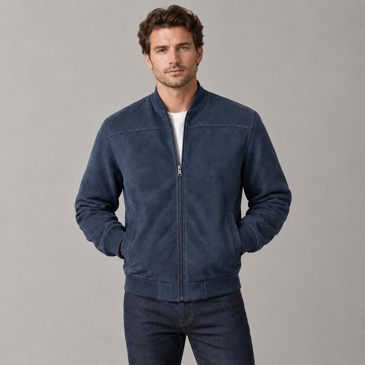 Kinloch Faux Suede Bomber Jacket — Navy faux-suede bomber jacket worn by a model against a neutral studio backdrop.