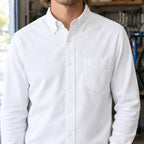 Longford Cotton Oxford Shirt — White cotton oxford shirt worn, cropped from the shoulders to the waist to show the button-down collar and chest pocket.