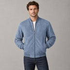 Kinloch Faux Suede Bomber Jacket — Light blue faux-suede bomber jacket worn by a model against a neutral studio backdrop.