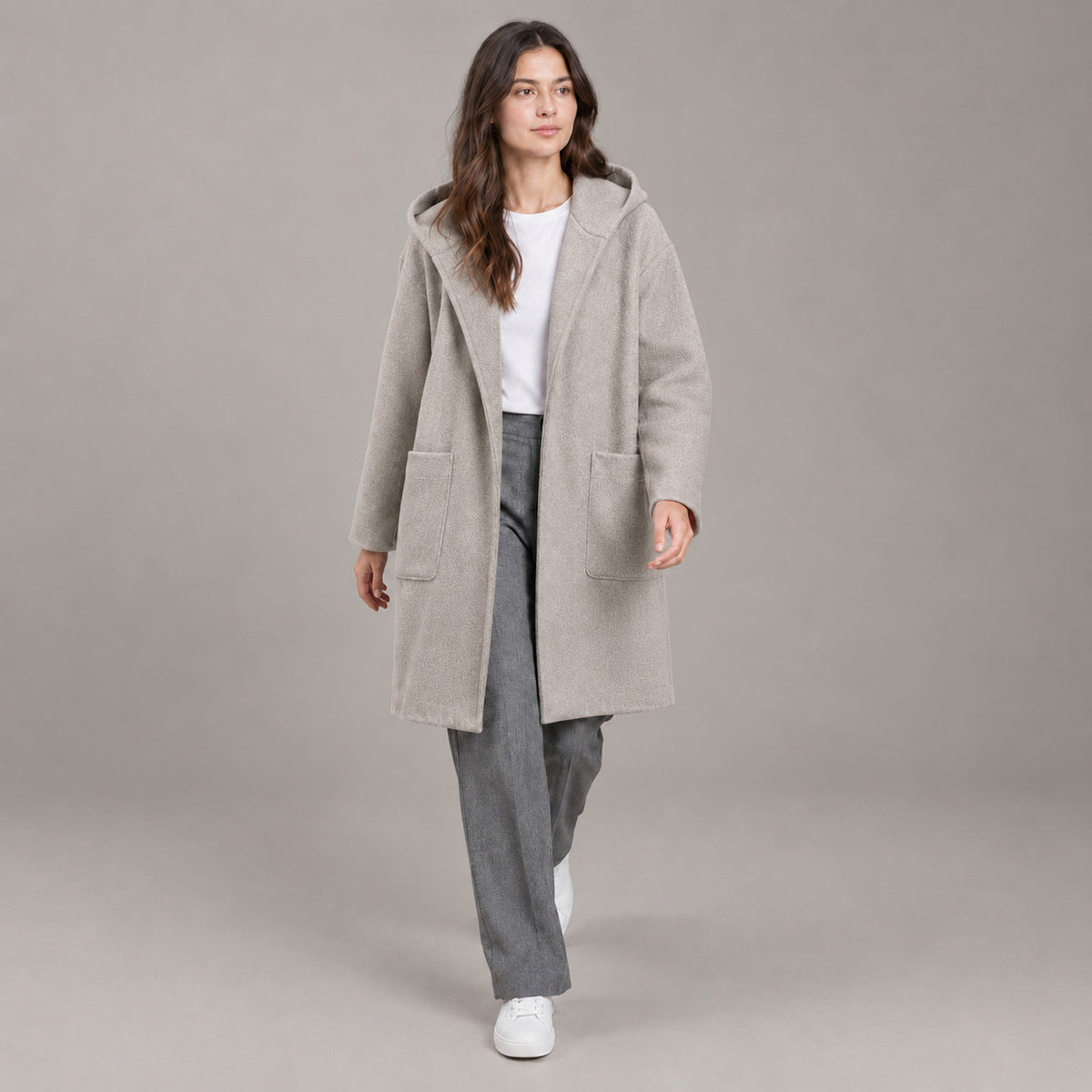 Lothian Brushed Hooded Coat — Solid heather oatmeal relaxed mid-length hooded coat worn by a model against a neutral studio backdrop.