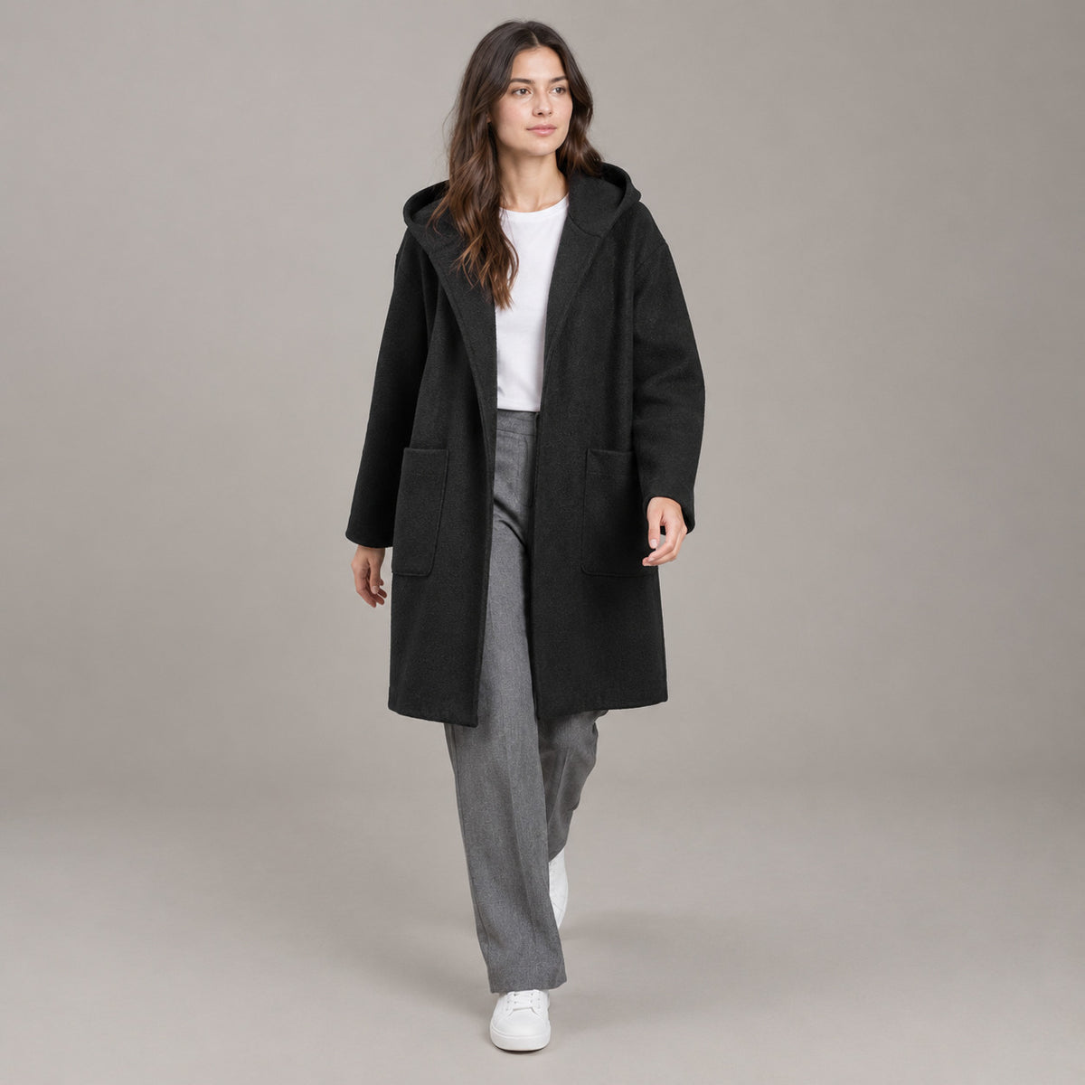 Lothian Brushed Hooded Coat — Solid black relaxed mid-length hooded coat worn by a model against a neutral studio backdrop.