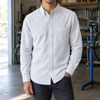 Longford Cotton Oxford Shirt — Gray Stripe cotton oxford shirt worn by a model in a navy panelled room.