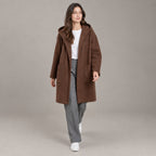 Lothian Brushed Hooded Coat — Solid warm brown relaxed mid-length hooded coat worn by a model against a neutral studio backdrop.