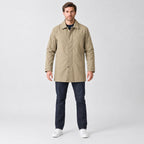 Chalcot Quilted Car Coat — Khaki car coat worn by a model against a studio backdrop.