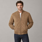 Kinloch Faux Suede Bomber Jacket — Caramel faux-suede bomber jacket worn by a model against a neutral studio backdrop.