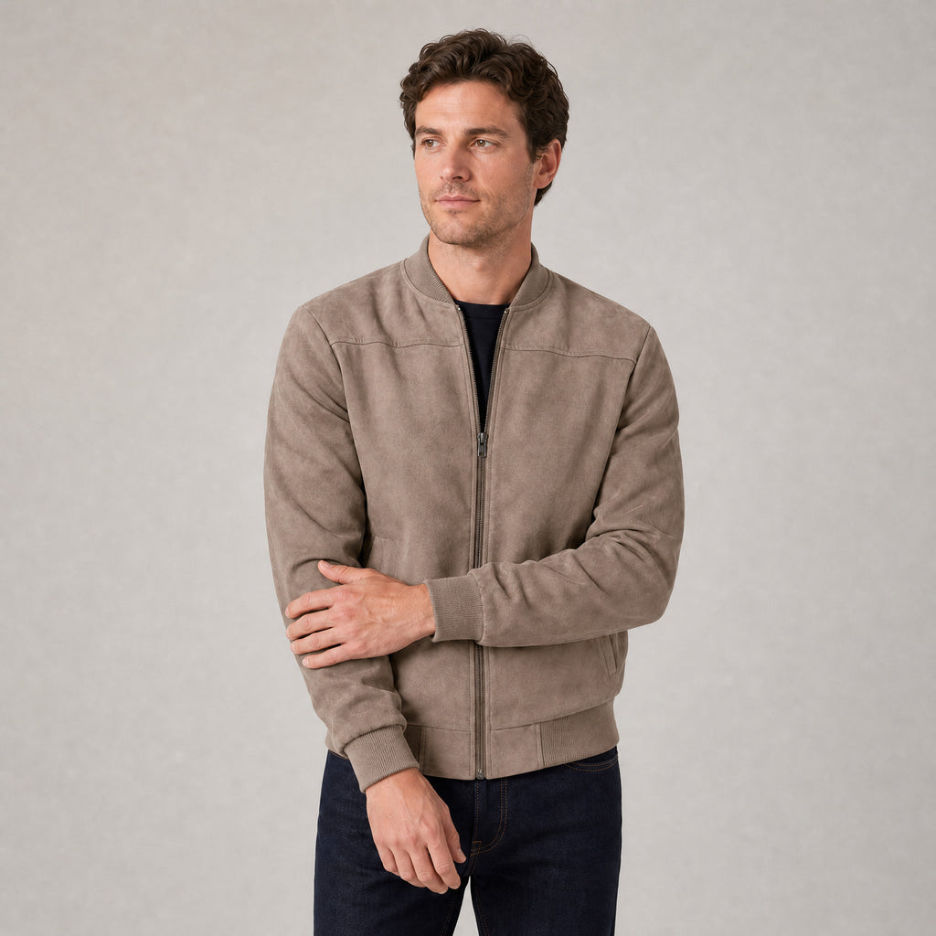 Hartfield Faux Suede Bomber Jacket — Khaki faux-suede bomber jacket worn by a model against a pale stone studio backdrop
