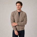 Hartfield Faux Suede Bomber Jacket — Khaki faux-suede bomber jacket worn by a model against a pale stone studio backdrop