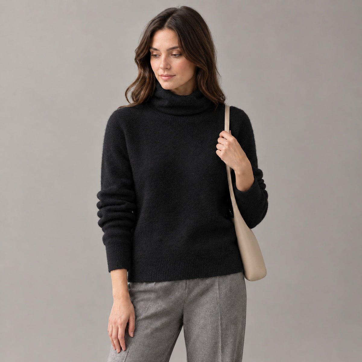 Rothbury Ribbed Knit Turtleneck — Black turtleneck sweater worn by a model against a neutral studio backdrop.