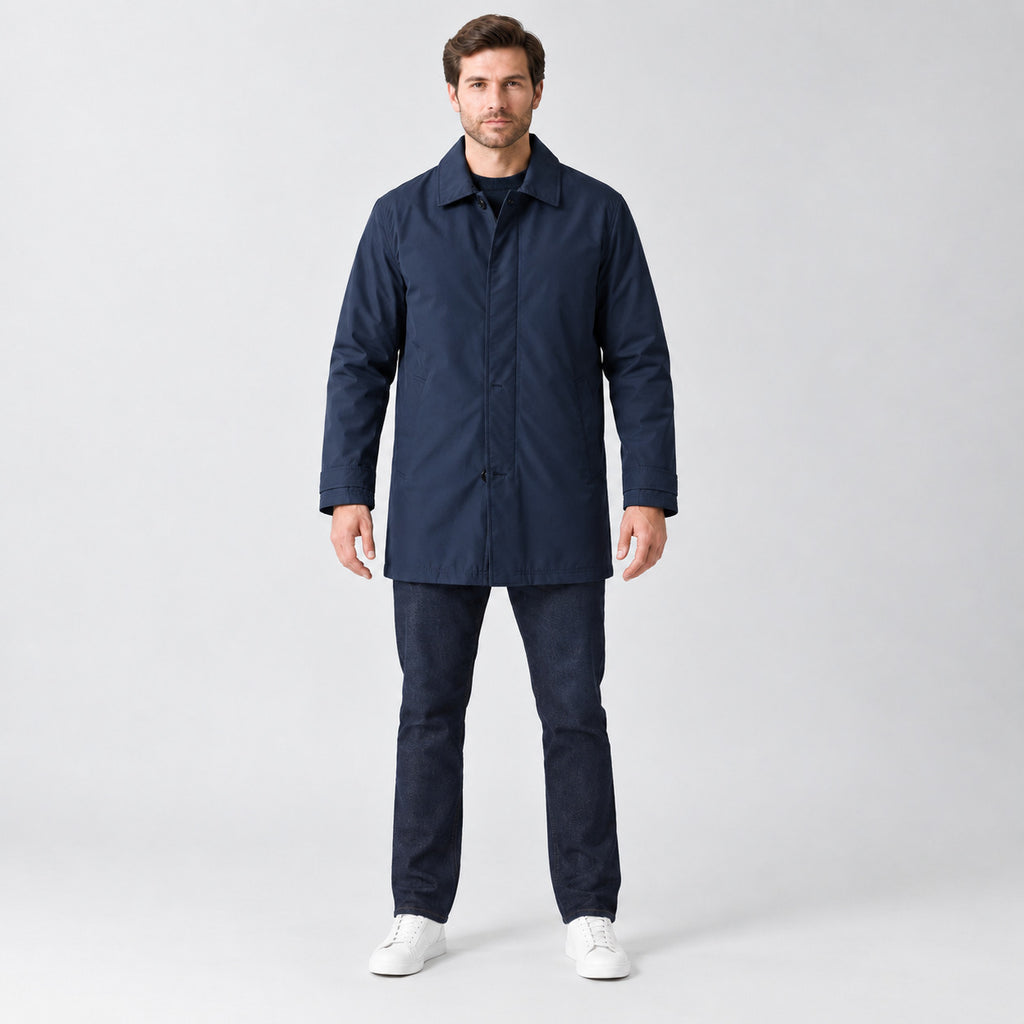 Chalcot Quilted Car Coat — Navy blue car coat worn by a model against a studio backdrop.