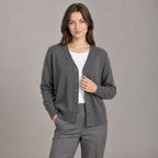 Merrion Fine Knit Cardigan — Dark gray V-neck button-down cardigan worn by a model against a seamless studio wall.