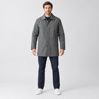 Chalcot Quilted Car Coat — Dark gray car coat worn by a model against a studio backdrop.